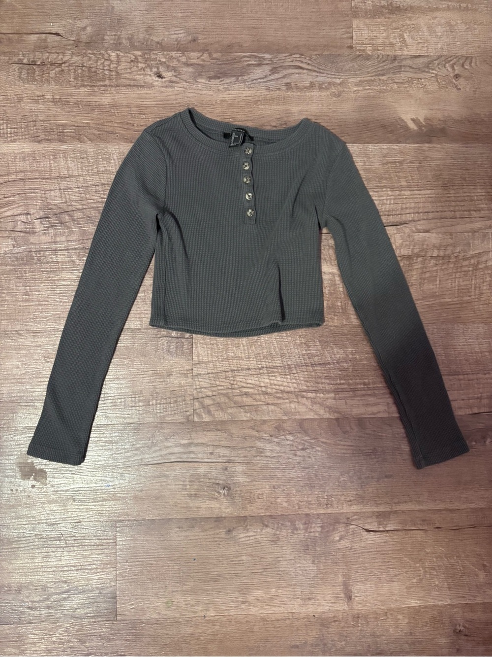 gray cropped long sleeve top with button detail